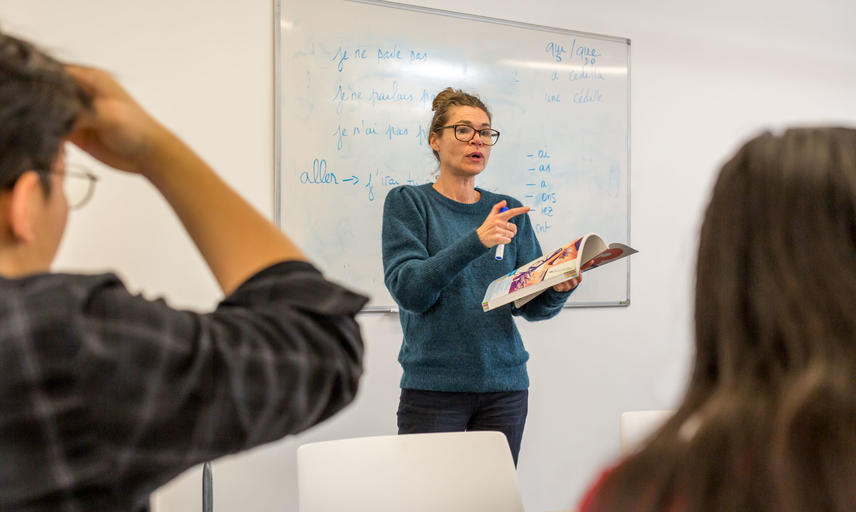 French Tutor teaching in classroom